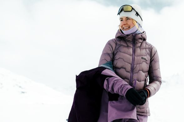 Woman in warm ski clothing in a snowy landscape